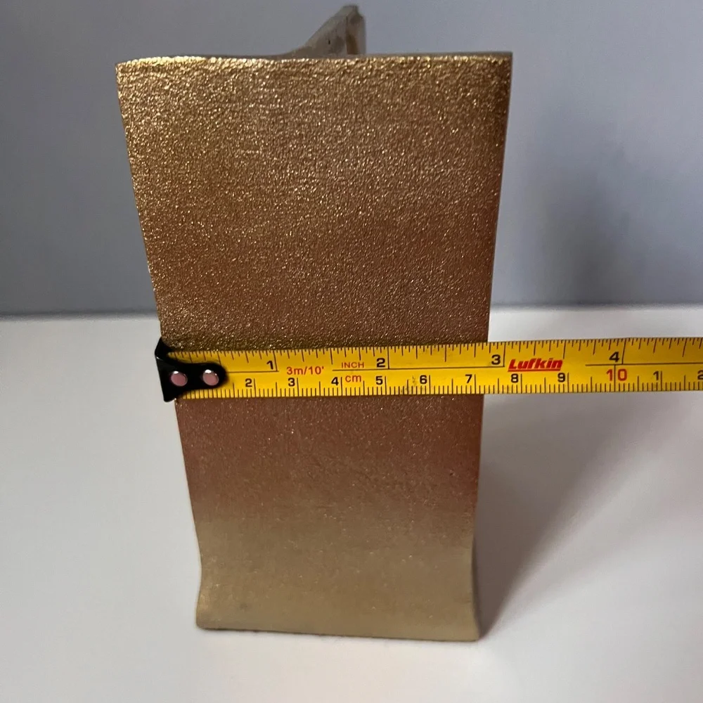 West Elm sculptural bookend in textured antique gold finish.